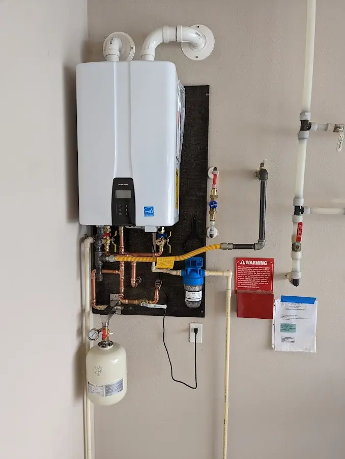 Professional plumber installing copper piping in a Montoursville home